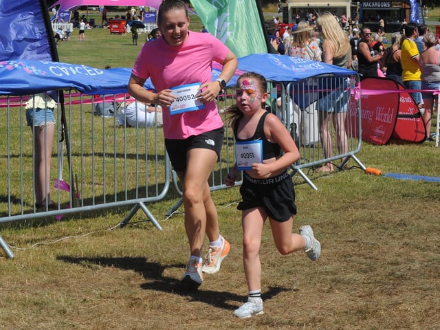 Jamielle Auty and Ava Frew, eight, of Leeds at the finish line