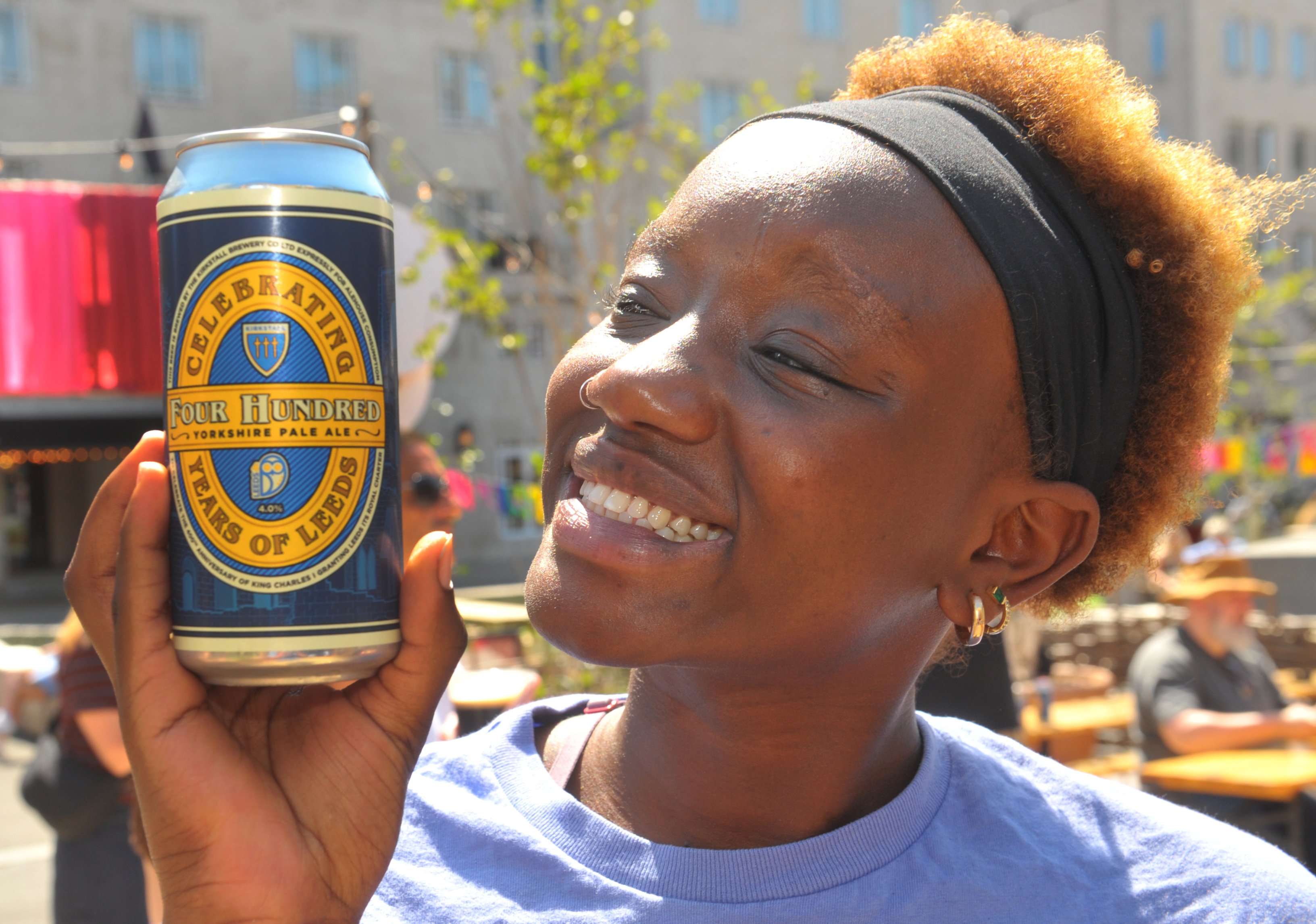 Sahara Akeno  enjoys her free can of Leeds 400 beer from Kirkstall Brewery during a birthday picnic with live music.