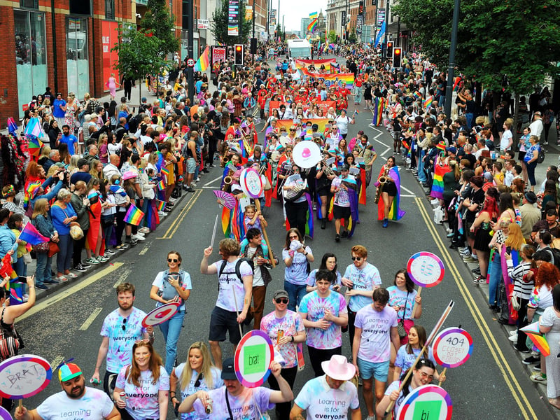 The vibrant parade makes itsa way through the city centre.