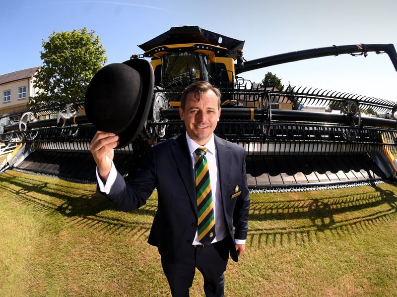 Society Manager David Tite pictured with Worlds largest Combine Harvest, the New Holland CR11.