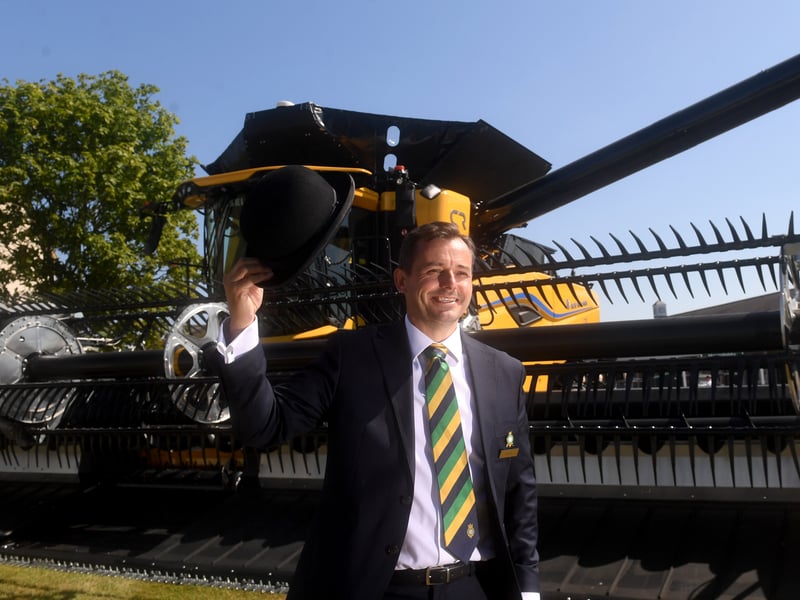 Society Manager David Tite pictured with Worlds largest Combine Harvest, the New Holland CR11