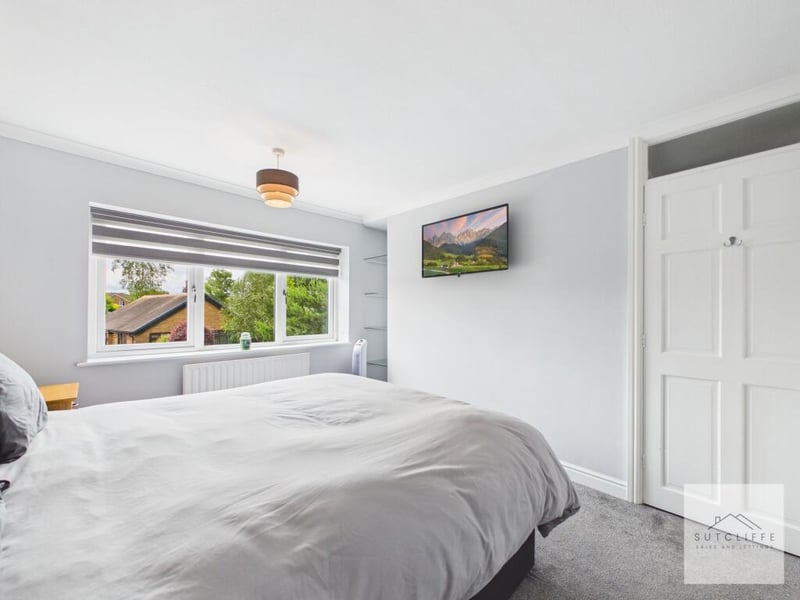 The primary bedroom from another angle