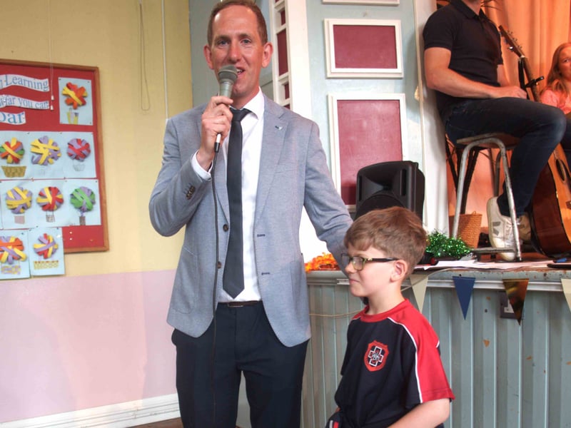 Presentation Primary School Principal Pat Robinson presents an award to pupil Ryan O'Dwyer for perfect attendance at school