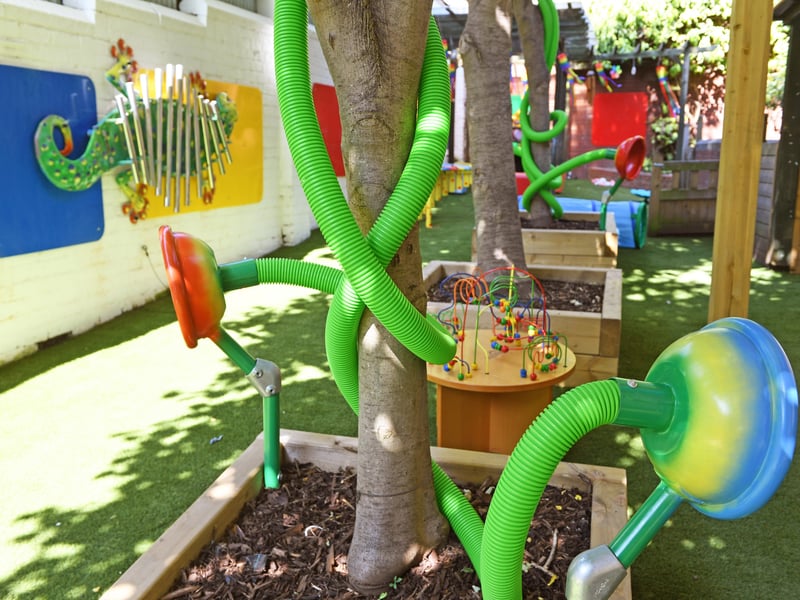 The garden features raised flower beds and plenty of activities to keep youngsters entertained and engaged.