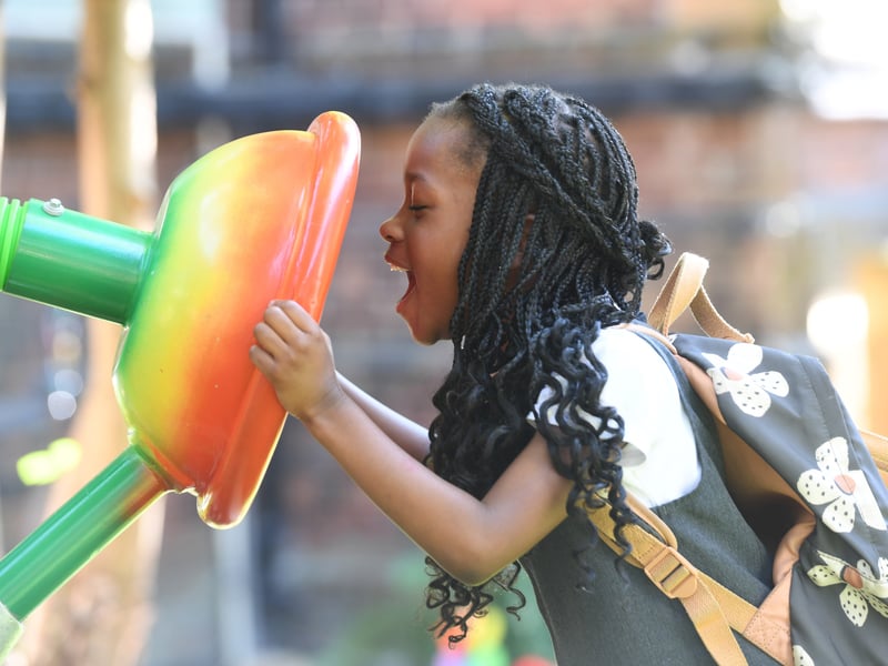 Children play in the sensory garden for the first time.