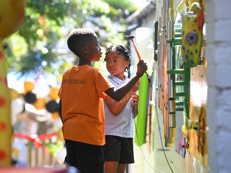 Children play together in the sensory garden.