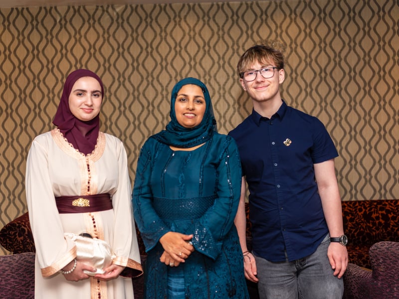 Two Sixth Form students enjoying the evening with Mrs Aslam.