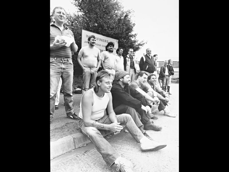 Workers at IMI Refiners Ltd gather during a mass walkout in July 1989 after management announced plans to lay off 10 men in the smelting plant. With some sitting and others standing, the group appears remarkably cheerful despite the dispute. Do you recognise anyone in the picture, or remember the walkout at IMI Refiners?