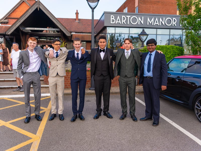 Suits on, smiles ready, Prom night underway.