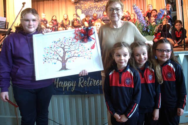 Pupils present gifts to retiring secretary Barbara Bennett