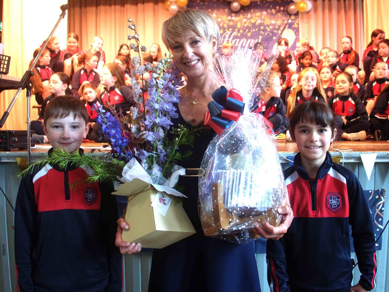 Pupils present gifts to retiring teacher Emma Power 