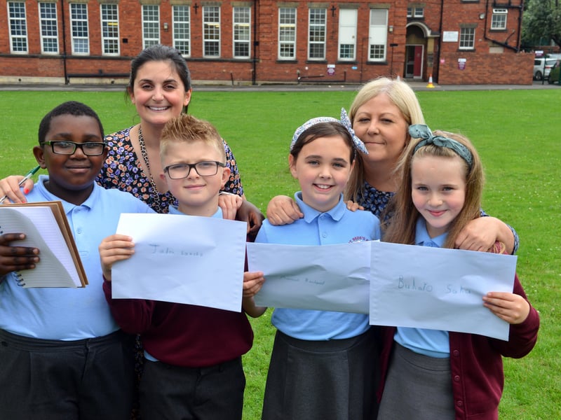St Bede's Primary School children took a stand against racist abuse in football in 2021. Pictured from left are Ivan Murwisi, Joshua Rixom, Jessica Roberts, and Lainey Bradley,with teacher Jessica Romano and teaching assistant Sharon Hunt.