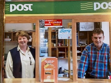 Retiring postmaster Barry Connolly with his late mother Anne in Fethard Post Office during her time as postmistress. 