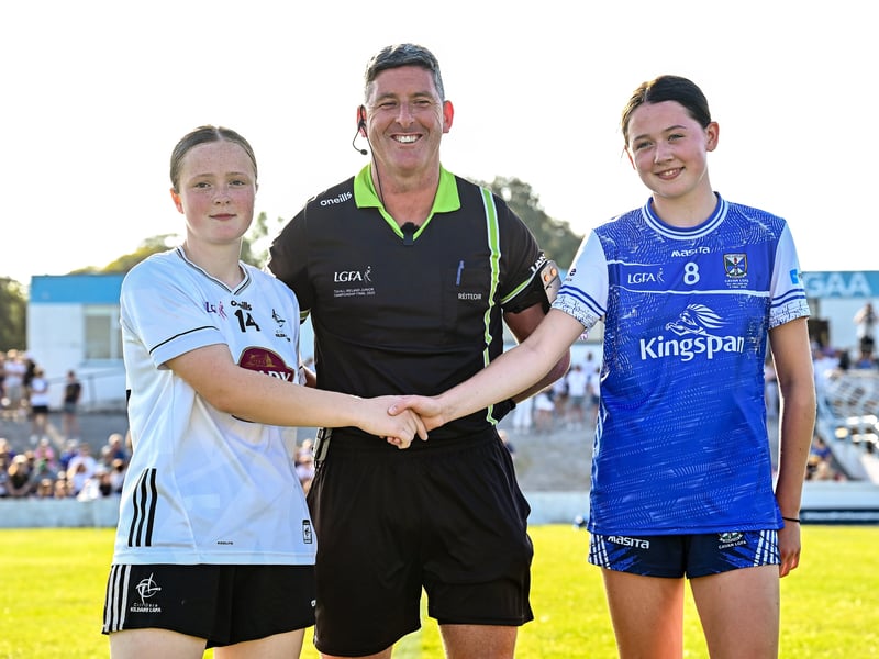 Referee Conor McCarthy with Kildare captain Amy Wall and Cavan captain Aoife Rogers before the 2026 AirNav Ireland All-Ireland U-16 A Championship final match between Cavan and Kildare at Páirc Chiarain in Westmeath. Photo by Seb Daly/Sportsfile