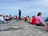 Caroline Rouine O’Connor guiding an outdoor meditation session.