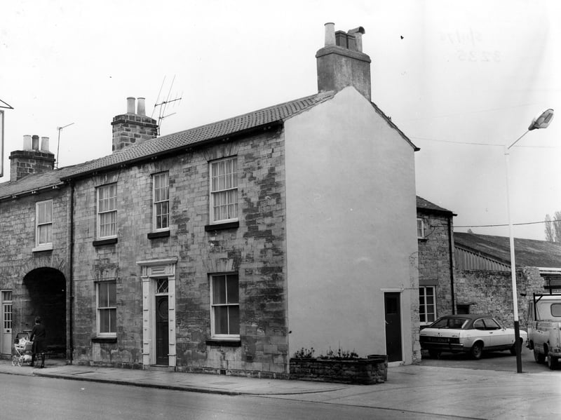 The offices at Jack Joy Insurance at 66 North Street. On the left is a woman pushing a pram. Pictured in November 1975.