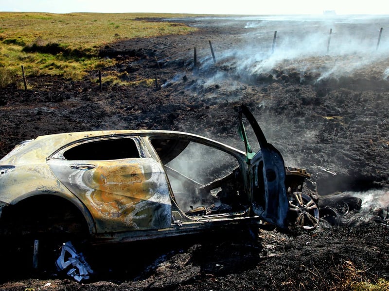 Burnt out car that sparked wildfire.