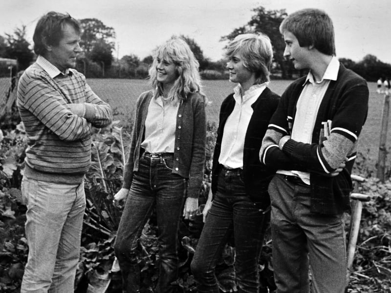 Gardeners’ World comes to Newport. BBC-2 presenter Geoff Hamilton meets young gardening enthusiasts during a rehearsal for the programme at Burton Borough School in September 1982. Pictured are Jane and Claire Stanway of Avondale, Newport, and Chris Norton of Church Aston. Do you remember seeing Newport on television?