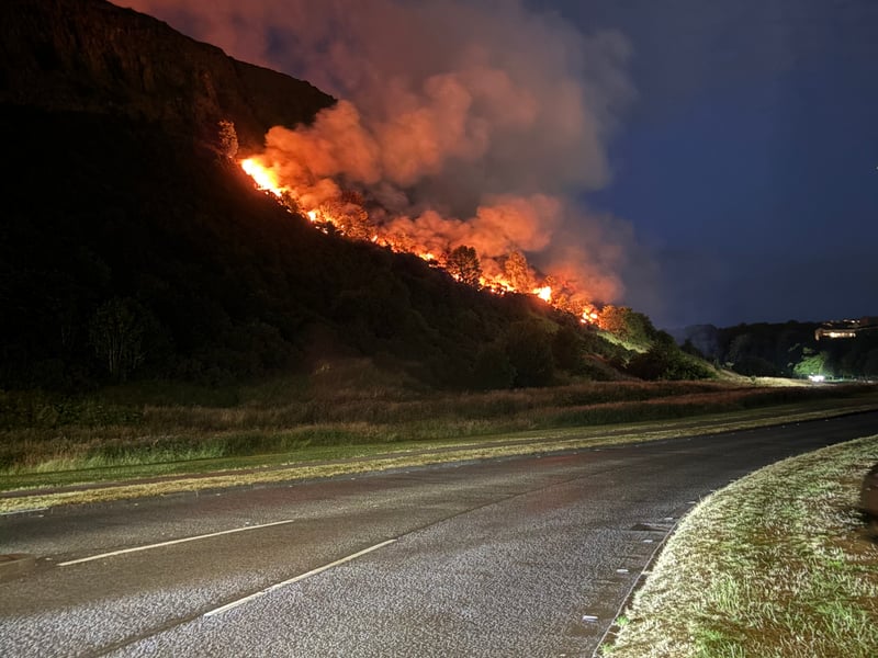 The flames could be seen just metres from Queen's Drive, which was later closed as the fire escalated