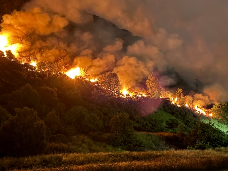 Initially contained to two spots, the fire spread in both directions overnight