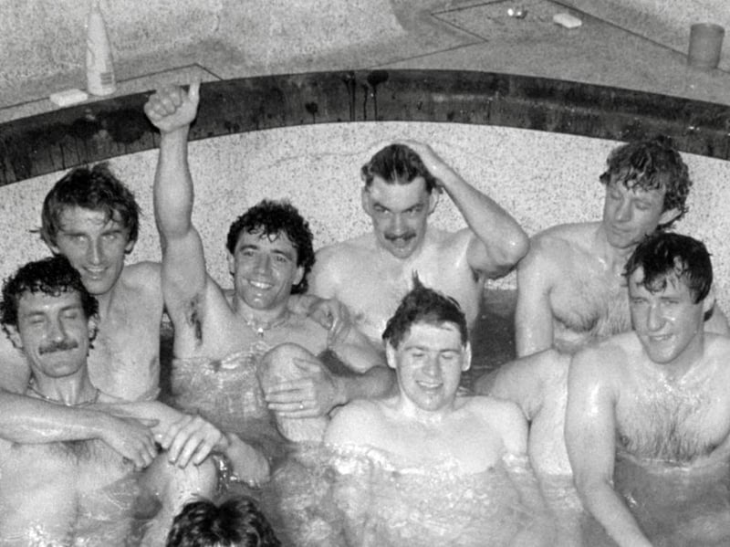 Newcastle players left to right, Terry McDermott, John Anderson, Kevin Keegan, Kevin Carr, Chris Waddle, David Mills and Steve Carney (front right) celebrate in the team bath after their 4-0 victory over Derby in 1984. (Photo by Danny Brannigan/Hulton Archive)