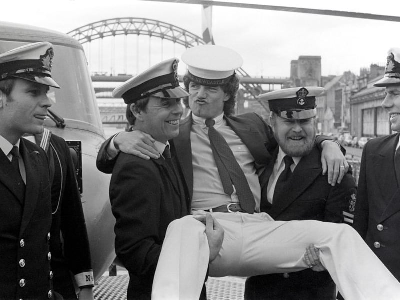 Kevin gets a helping hand from officers on HMS Newcastle on the Quayside in 1983. (Photo by Julian Brannigan/Hulton Archive)