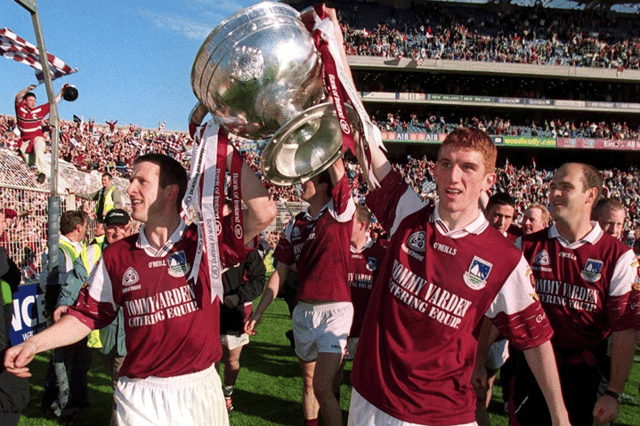 Captain Gary Fahey, left, of Galway and team-mate Kieran Fitzgerald holding Sam Maguire aloft