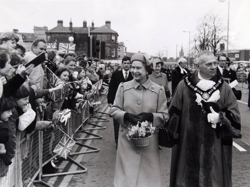 April 195 and The Queen accompanied by the Lord Mayor of Harrogate does a walkabout on Station Parade.