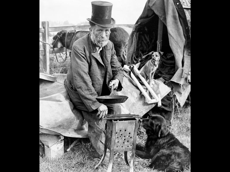 Fred Abel, ringmaster and owner of self-proclaimed "smallest show on Earth," cooks up a spot of breakfast near Penkridge in August 1962. Dressed in his iconic top hat, Fred pauses over a small portable stove alongside his loyal animal performers, including his star act, Towser the wonder dog. Long before television and modern entertainment dominated everyday life, itinerant performers like Fred travelled the country, bringing a touch of wonder, magic, and traditional circus charm to small Staffordshire communities. What memories do you have of circuses, fairs, or travelling shows coming to your area back in the 1960s?