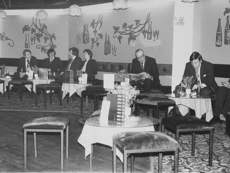 Businessmen enjoy their lunch in pleasant surroundings in 1978.