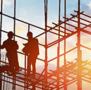 Two people working on a construction site