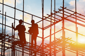 Two people working on a construction site