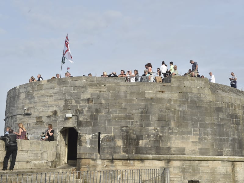 HMS Prince of Wales returned home to HMNB Portsmouth on July 24, 2026, after completing the first phase of Operation Firecrest. Families and friends gathered along the Hot Walls and on The Round Tower in Old Portsmouth to welcome the sailors back to base.