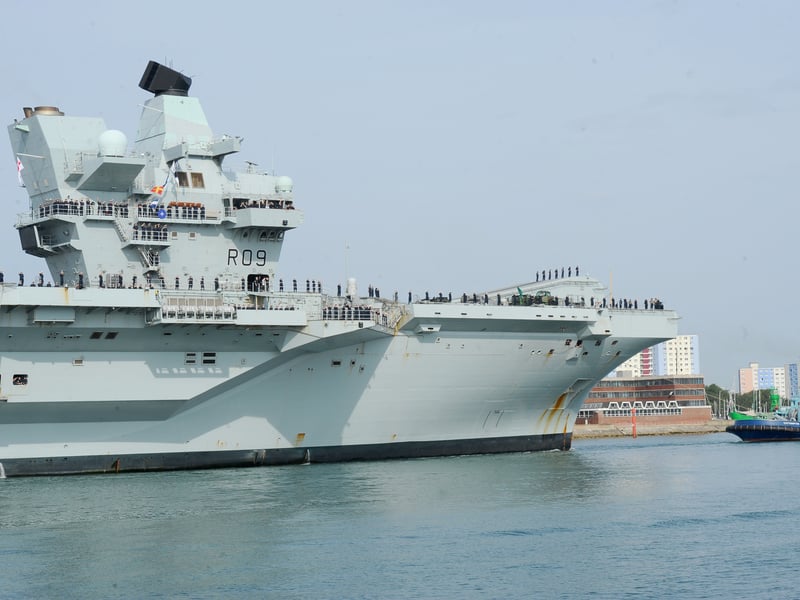 HMS Prince of Wales returned home to HMNB Portsmouth on July 24, 2026, after completing the first phase of Operation Firecrest. Families and friends gathered along the Hot Walls and on The Round Tower in Old Portsmouth to welcome the sailors back to base.