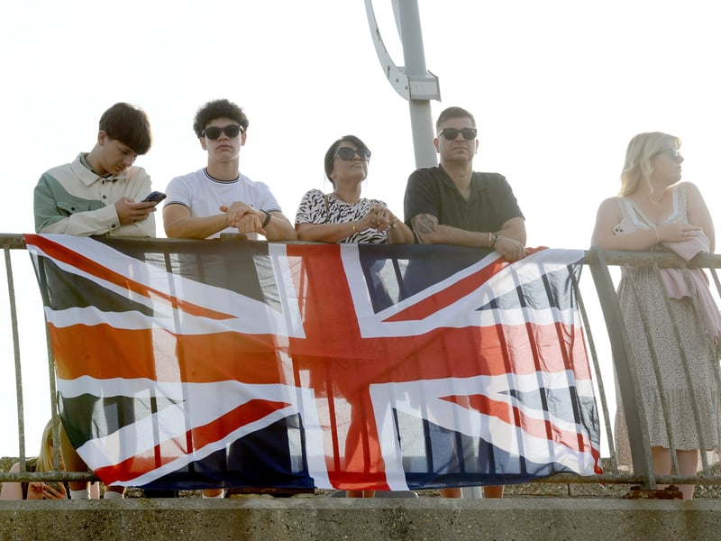 HMS Prince of Wales returned home to HMNB Portsmouth on July 24, 2026, after completing the first phase of Operation Firecrest. Families and friends gathered along the Hot Walls and on The Round Tower in Old Portsmouth to welcome the sailors back to base.
