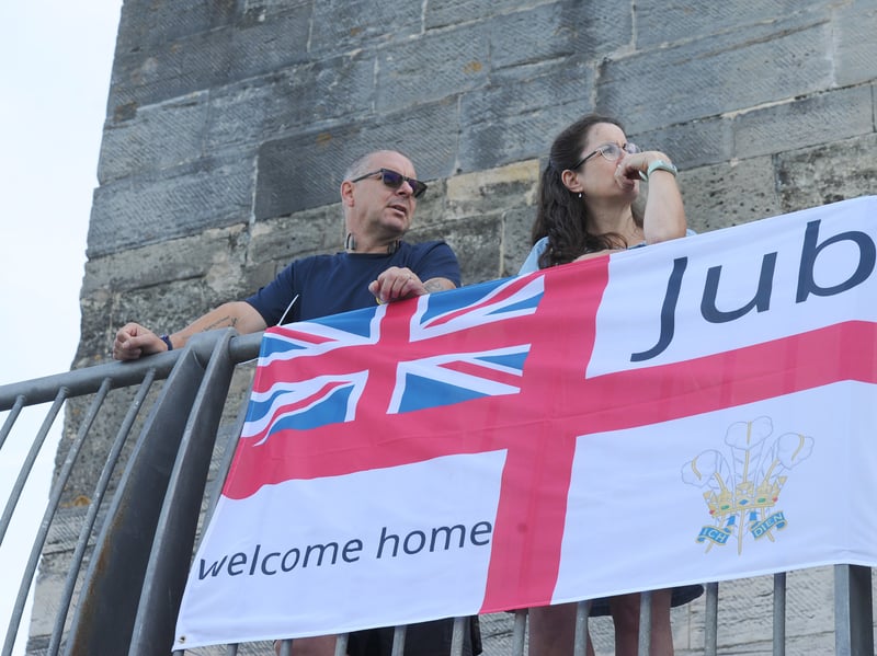 HMS Prince of Wales returned home to HMNB Portsmouth on July 24, 2026, after completing the first phase of Operation Firecrest. Families and friends gathered along the Hot Walls and on The Round Tower in Old Portsmouth to welcome the sailors back to base.