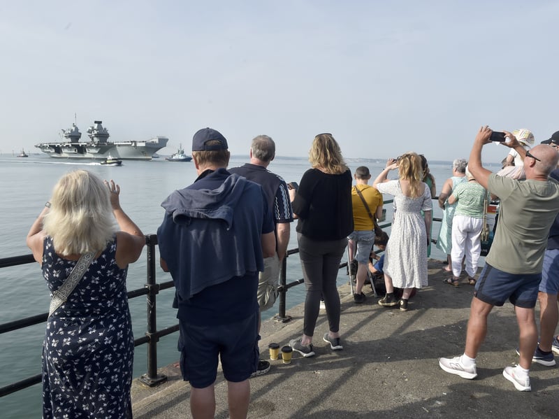 HMS Prince of Wales returned home to HMNB Portsmouth on July 24, 2026, after completing the first phase of Operation Firecrest. Families and friends gathered along the Hot Walls and on The Round Tower in Old Portsmouth to welcome the sailors back to base.