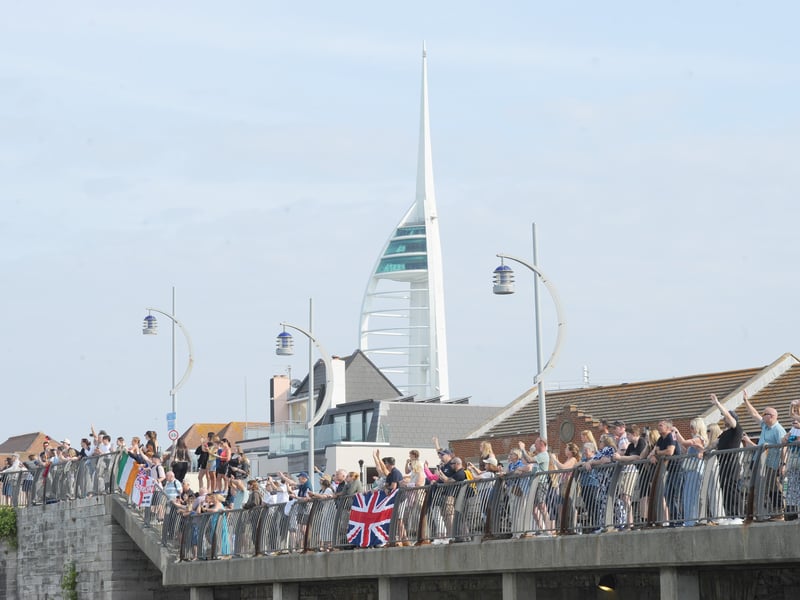HMS Prince of Wales returned home to HMNB Portsmouth on July 24, 2026, after completing the first phase of Operation Firecrest. Families and friends gathered along the Hot Walls and on The Round Tower in Old Portsmouth to welcome the sailors back to base.