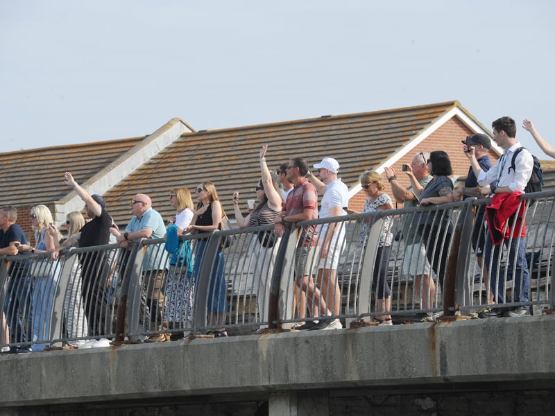 HMS Prince of Wales returned home to HMNB Portsmouth on July 24, 2026, after completing the first phase of Operation Firecrest. Families and friends gathered along the Hot Walls and on The Round Tower in Old Portsmouth to welcome the sailors back to base.