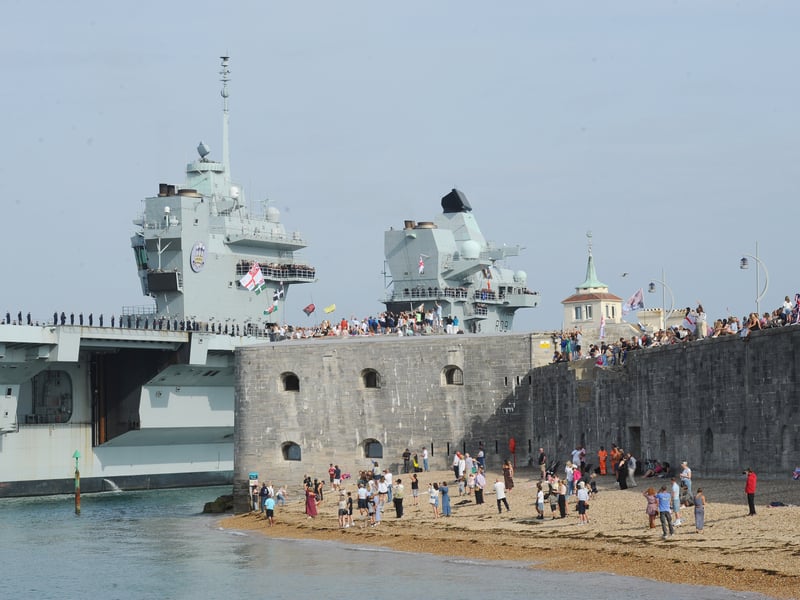 HMS Prince of Wales returned home to HMNB Portsmouth on July 24, 2026, after completing the first phase of Operation Firecrest. Families and friends gathered along the Hot Walls and on The Round Tower in Old Portsmouth to welcome the sailors back to base.