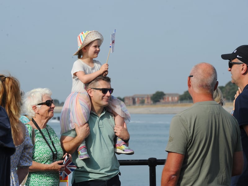 HMS Prince of Wales returned home to HMNB Portsmouth on July 24, 2026, after completing the first phase of Operation Firecrest. Families and friends gathered along the Hot Walls and on The Round Tower in Old Portsmouth to welcome the sailors back to base.