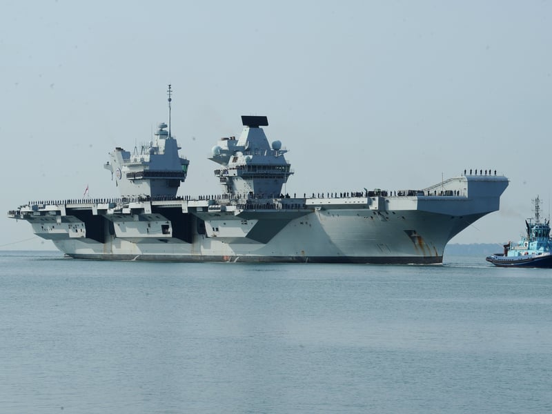 HMS Prince of Wales sailing towards HMNB Portsmouth.
