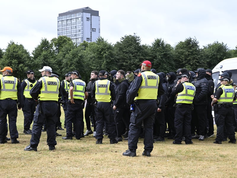 Police contain members of the Green Brigade, a Celtic FC fan group, gathering for a pro-immigration counter-protest to the Unite the Clans Scotland anti-immigration protest, at Glasgow Green.