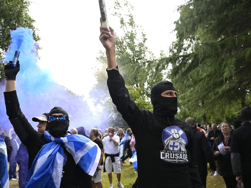 Police chased and held back “Unite the Clans” demonstrators who ran towards an anti-fascist group, with many on both sides wearing masks.