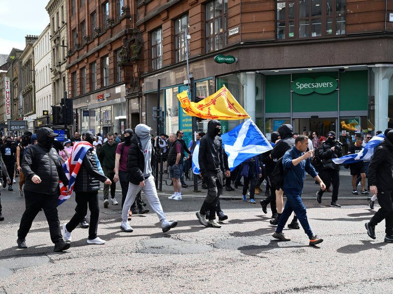 A group of demonstrators from the anti-immigration protest, organised by Unite the Clans Scotland, break away from the rally and march towards Glasgow city centre.