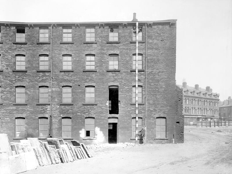 Appleyard's warehouse premises on Tenter Lane, formerly used by George Appleyard and son, drysalters. To the left is Swinegate, with the Golden Lion Hotel at nos. 52/53. Pictured in May 1907.