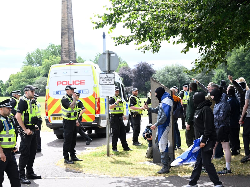 Protesters in a stand-off with police during an anti-immigration protest, organised by Unite the Clans Scotland, at Glasgow Green.