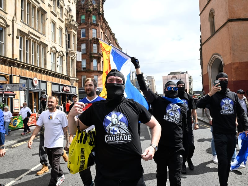 A group of demonstrators from the anti-immigration protest, organised by Unite the Clans Scotland, break away from the rally and march towards Glasgow city centre