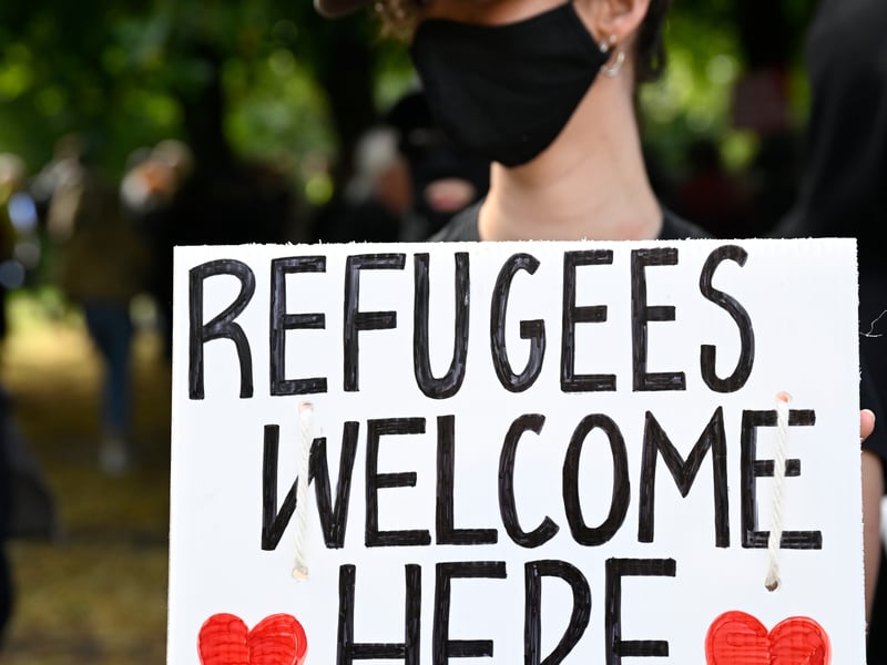 An estimated 200 people joined the anti- immigration protest in the park while around 2,000 anti-racist protesters gathered outside near the High Court.