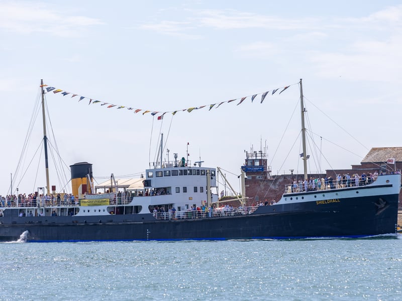 SS Shieldhall sailing into Portsmouth ahead of the Clipper yachts returning to the city.